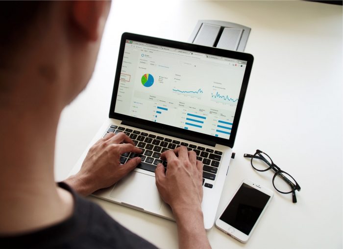 Man using Google Analytics on a laptop.